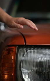 a-hand-holding-a-car-door.jpg a hand holding a car door